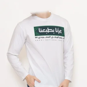White saudi national day long sleeve t-shirt with عزنا بطبعنا chest print